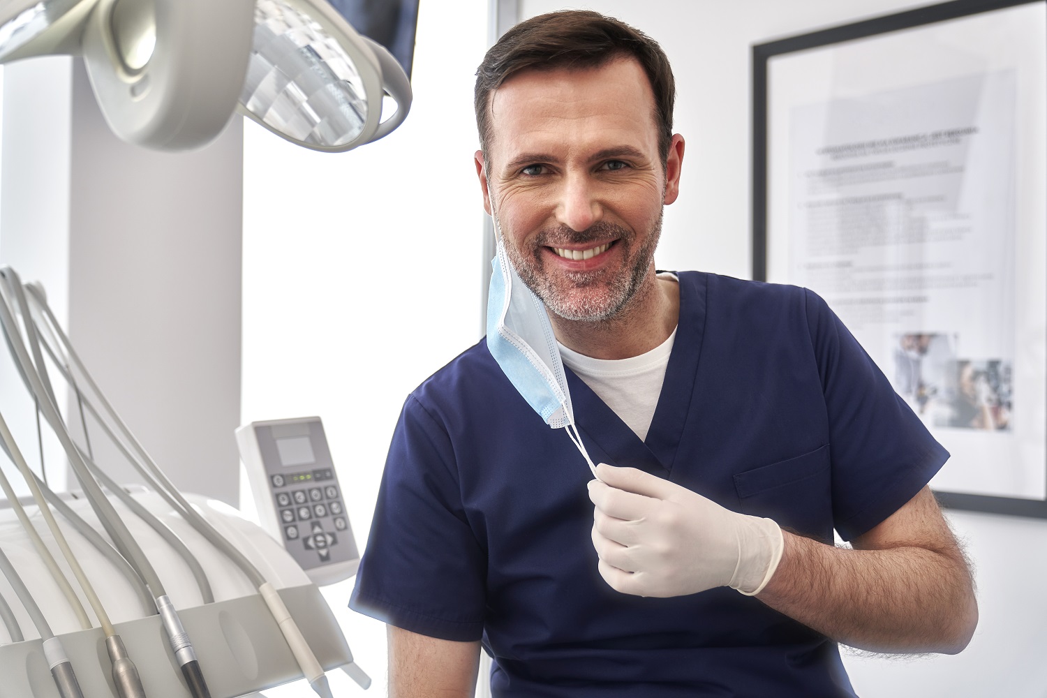 Portrait Of Male Dentist At The Dentist's Office - C. A. Nova Contábil